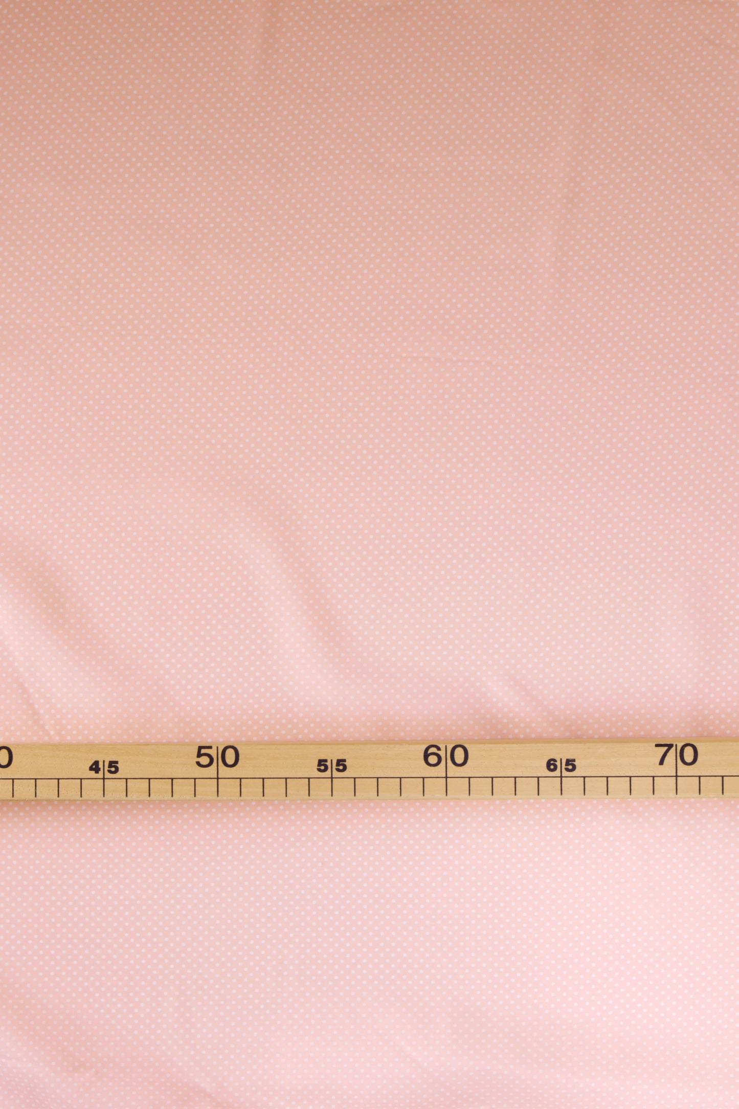 Popeline de viscose rose pêche à pois blancs