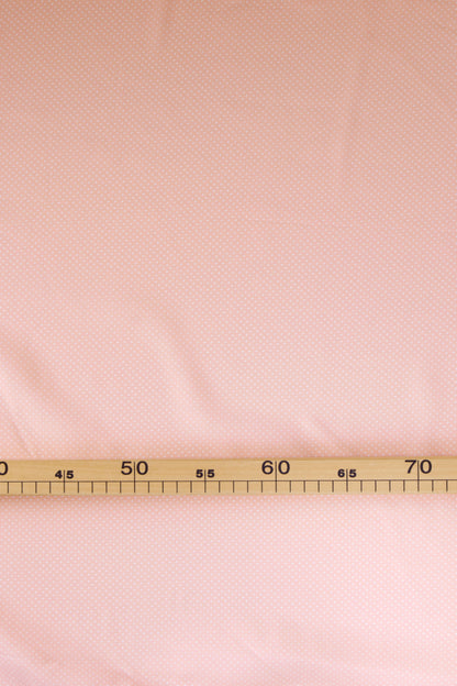 Popeline de viscose rose pêche à pois blancs