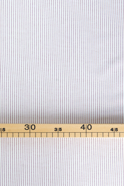Popeline/toile de coton avec petites rayures 2mm blanc/violet et vert pour couture de vêtement. chez muremure mercerie poéthique en ligne